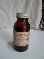 E1--GÜNDÜZ ECZANESİ ETİKETLİ İLAÇ ŞİŞESİ