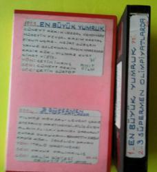 Efemera - 1-EN BÜYÜK YUMRUK-CÜNEYT ARKIN- -2-ÜÇ SÜPERMEN OLİMPİYATLARDA-YILMAZ KÖKSAL-LEVENT ÇAKIR VHS VİDEO - - kitantik - kitaLog