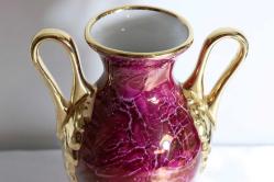 Limoges imzalı el boyaması porselen çift kulplu vazo. Taban çapı 6,5cm. Y 24cm.