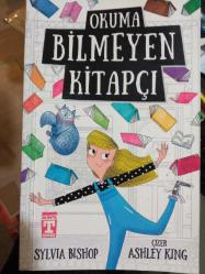 OKUMA BİLMEYEN KİTAPÇI
