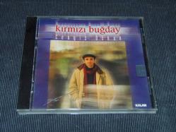CENGİZ ÖZKAN-KIRMIZI BUĞDAY-SIFIR AYARINDA DÖNEM BASKI MÜZİK CD'Sİ