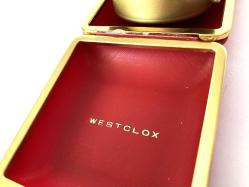 WEST CLOX ANTİKA SEYAHAT SAATİ- KURMALI ALARMLI ÇALAR SAAT , BAKIMLARI YAPILMIŞ OLUP, BÜTÜN AKSAMLARI TAM ORJİNAL ZAMAN TUTUŞLARI GAYET İYİDİR ANCAK KAPAK KAPANMAMAKTADIR.