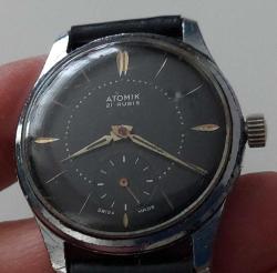 İSVİÇRE ATOMİK MARKA ANTİK KURMALI BAKIMLI MUHTEŞEM ORİJİNAL SİYAH KADRAN KOL SAATİ VV3TTT2