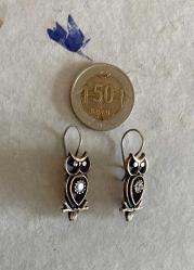 Eskitme, altın küpe görselinde küpe.