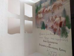 SANAT KARTPOSTALI-EV ÇERÇEVESİ ŞEKLİNDE DİZAYN EDİLMİŞ KARLAR ALTINDA KASABA RESMİ,KAPAKLI,İÇ KISMINA YAZILMIŞ,RENKLİ, 12 X 17 CM EBADINDA