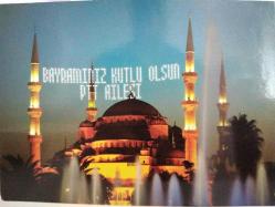 CAMİ MİMARELERİ ARASINA YAZILMIŞ ''BAYRAMINIZ KUTLU OLSUN PTT AİLESİ'' GÖRÜNTÜSÜ KARTPOSTALI,ARKASINA YAZILMAMIŞ,RENKLİ, 11,5 X 16 CM EBADINDA