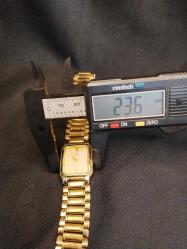 SAAT KOL SAATİ MOMENTUS UNİSEX KOL SAATİ.22 AYAR ALTIN KAPLAMA.POLİSAJA İHTİYACI VAR.ÇALIŞIYOR 175