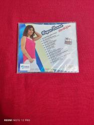 TUĞÇE ÖZCAN SEVDİĞİM CD AMBALAJINDA