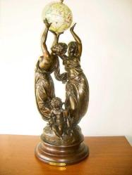 Le Globe Fransız sanatçı  Petit imzalı tutya heykel, mitolojik kadın figürlü. İmzalı. Y:62 cm.