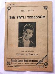 Zeki Müren'in Bir Tatlı Tebessüm Şarkısının Notaları - Uşşak Şarkı - İskender Kudmani Halefi Ferit Kudmani Yayımı (1466 No - 100 Kuruş) - 20,5 x 14 cm Ebadında - 4 Sayfa - Orijinal, Dönemine Ait