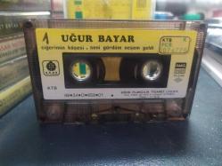 UĞUR BAYAR - CİĞERİMİN KÖŞESİ - SENİ GÖRDÜM NEŞEM GELDİ - KASET [kağıt baskı - sarı bandrol - etikette yazı var]