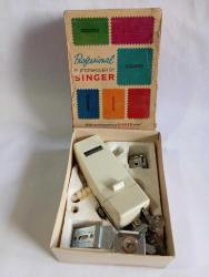 Singer dikiş makinesi parçası kutusunda