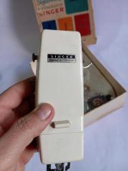 Singer dikiş makinesi parçası kutusunda