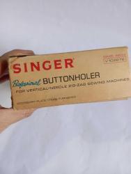Singer dikiş makinesi parçası kutusunda