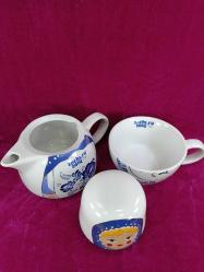 RUSYA SOCHI.RU 2014 OLİMPİYAT OYUNLARI HATIRASI MATRUŞKA BEBEK RESİMLİ PORSELEN DEMLİK VE FİNCAN