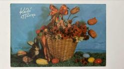 HEDİYE KARTPOSTALI - 15 x 10 cm EBADINDA - ARKASI YAZILI - YEŞİLLİKLERİN ARASINDA RENKLİ PASKALYA YUMURTALARI VE ÇİÇEKLERLE SÜSLÜ SEPET