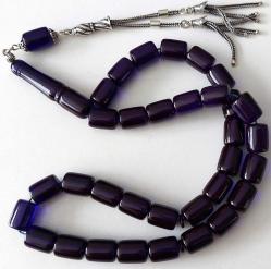 OSMANLI DÖNEMİ MÜCEVHER KUTUSUNDAN YAPILMA İŞIKTA MAVİ RENKLİ MÜTHİŞ İŞÇİLİKLİ MUHTEŞEM GÜMÜŞ PÜSKÜLLÜ SIKMA KEHRİBAR TESPİH 1RR1B1A ÇOK NADİR