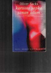 KARISINI ŞAPKA SANAN ADAM