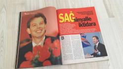 AKTÜEL HAFTALIK HABER DERGİSİ - SAYI:303   -30 NİSAN 1997  -  MELTEM CUMBUL “ÇİFT KUTUPLU SHOW-WOMAN” OLARAK TANITILIYOR – YÖNETMEN ORHAN OĞUZ, SEVGİLİSİ NİLÜFER’İ AKTÜEL İÇİN “ERKEĞİNİN GÖZÜYLE NÜ” FOTOĞRAFLADI – BİLİMADAMLARI “İNSANI DA UÇURURUZ” DİYEREK KURBAĞAYI HAVALANDIRAN DENEYİN MALİYETİNİ AÇIKLADI – EMEKLİ GENERAL ERGİN YURDDAY GAZİ OLAYLARINDA DAYAK YİYEN ÖZLEM TUNÇ’LA YILLAR SONRA YENİDEN BULUŞTU – “ASKERLİKTEN SONRA KAMERA KARŞISINA GEÇEN İLK GENERALİM” DİYEREK OYUNCULUĞA BAŞLADI – GAZİ OLAYLARINDAKİ POLİS ŞİDDETİNİ ELEŞTİRDİ, “DİYALOGLA HER SORUN ÇÖZÜLÜR” MESAJI VERDİ – SİYASETE GİRMEYE HAZIRLANAN YURDDAY “HALK MİLLETVEKİLİNİN EFENDİSİDİR” DİYEREK HYDE PARK PROJESİNİ DUYURDU – “SUSURLUK SADECE BİR AYRINTI” DİYEREK DERİN DEVLET TARTIŞMALARINA FARKLI BİR YORUM GETİRDİ –  MELTEM CUMBUL – ORHAN OĞUZ – NİLÜFER – ERGİN YURDDAY – ÖZLEM TUNÇ – KANDEMİR KONDAK – İSHAK ALATON – MEHMET AĞAR – SEDAT BUCAK – TANSU ÇİLLER – KORKUT EKEN – KAMRAN İNAN – BATUHAN YURDDAY –   130  SAYFA