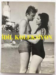 GÖKSEL ARSOY ve YEŞİLÇAM'IN KADIN YILDIZI FİGEN SAY'IN ORİJİNAL BÜYÜK BOY FOTOĞRAFI - 24 x 18 cm EBADINDA - GÖKSEL ARSOY ve FİGEN SAY BİR YEŞİLÇAM FİLMİ ÇEKİMİ SIRASINDA SAHİLDE BİRBİRLERİNE SARILIP BAKIŞIRLARKEN ÇEKİLMİŞ BİR KARE