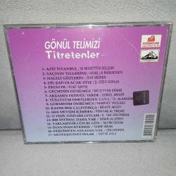 Cd Gönül Telimizi Titretenler. Orijinal 1993 Coşkun plak. Dinlemeyi etkilemeyen çizikler var. Sorunsuz çalışıyor.  Zeki Müren Müzeyyen Senar Münir Nurettin Selçuk Safiye Ayla Behiye Aksoy Hamiyet yüceses Saime S. Tur gülerman Nigar Uluer Mualla Mukadder Suat sayın Sevim deran Perihan Altındağ Gönül akkor.