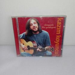 CD Kazım Koyuncu dünyada bir yerdeyim albümü. Dinlemeyi etkilemeyen çizikler var. Orijinal. sorunsuz çalışıyor.