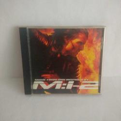 Cd Mission Impossible/Görevimiz Tehlike 2 Soundtrack. 2000 Almanya Baskı. Orijinal. Sorunsuz çalışıyor. Tracklist Limp Bizkit? Take A Look Around (Theme From M:I-2) 5:20 Metallica? I Disappear 4:26 Rob Zombie? Scum Of The Earth 2:55 Butthole Surfers? They Came In 4:42 The Pimps? Rocket Science 3:30 Foo Fighters & Brian May? Have A Cigar 4:02 Chris Cornell? Mission 2000 3:42 Godsmack? Going Down 3:23 Uncle Kracker? What U Lookin' At? 5:12 Apartment 26? Backwards 3:09 Diffuser (2)? Karma 3:16 Buckcherry? Alone 3:24 Tinfed? Immune 3:49 Powderfinger? My Kinda Scene 4:26 Tori Amos? Carnival 4:18 Hans Zimmer? Nyah 3:32 Credits (2)