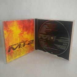 Cd Mission Impossible/Görevimiz Tehlike 2 Soundtrack. 2000 Almanya Baskı. Orijinal. Sorunsuz çalışıyor. Tracklist Limp Bizkit? Take A Look Around (Theme From M:I-2) 5:20 Metallica? I Disappear 4:26 Rob Zombie? Scum Of The Earth 2:55 Butthole Surfers? They Came In 4:42 The Pimps? Rocket Science 3:30 Foo Fighters & Brian May? Have A Cigar 4:02 Chris Cornell? Mission 2000 3:42 Godsmack? Going Down 3:23 Uncle Kracker? What U Lookin' At? 5:12 Apartment 26? Backwards 3:09 Diffuser (2)? Karma 3:16 Buckcherry? Alone 3:24 Tinfed? Immune 3:49 Powderfinger? My Kinda Scene 4:26 Tori Amos? Carnival 4:18 Hans Zimmer? Nyah 3:32 Credits (2)