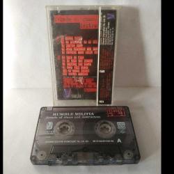 Kaset rumble militia, decade of chaos and destruction albümü. 1997 İzzet Öz Productions. Rumble Militia, 1985'te bir Yunan bir Türk ve iki Alman tarafından Almanya'nın Bremen kentinde kurulmuş thrash metal/crossover grubudur