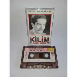 Kaset Fatih Kısaparmak kilim - Nazlı bebe albümü. 1989 Kağıt Baskı. Kasette yazı var.