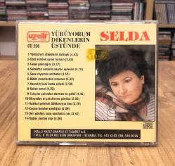 SELDA YÜRÜYORUM DİKENLERİN ÜSTÜNDE CD UZELLİ BASKI SARI BANDROL