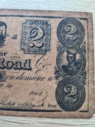 ÇOK NADİR -İkili Lot — ABD Kâğıt Para Tarihi: Ohio Rail Road $2 “Obsolete Scrip” (c.1838–40’lar, RW&H gravür) + Confederate States of America $20 (1864, mavi arka) | Orijinal | Tarihî belge