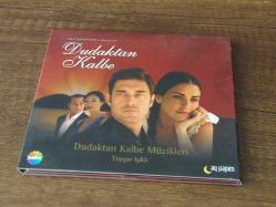 TOYGAR IŞIKLI - DUDAKTAN KALBE DİZİ MÜZİKLERİ  .. DÖNEM BASKISI MÜZİK CD SİDİR.