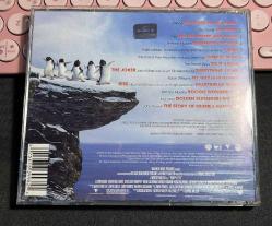 HAPPY FEET - MUSIC FROM THE MOTION PICTURE - FEATURING THE SONG OF THE HEART BY PRINCE & HIT ME UP THE DEBUT SINGLE FROM GIA FARRELL - WARNER BROS ENTERTAINMENT 2006