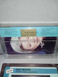 Kaset Zeki Müren gözlerin doğuyor gecelerime albümü. 1988 Kağıt Baskı. Orijinal. sorunsuz çalışıyor, koleksiyonluk