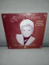 Cd Zeki Müren gözlerin doğuyor gecelerime. Orijinal Raks 1997 sarı bandrollü dönem baskı albüm. Disk 10 üzerinden 9.5 sorunsuz çalışıyor koleksiyonluk