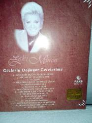 Cd Zeki Müren gözlerin doğuyor gecelerime. Orijinal Raks 1997 sarı bandrollü dönem baskı albüm. Disk 10 üzerinden 9.5 sorunsuz çalışıyor koleksiyonluk