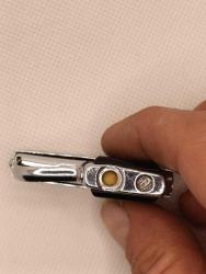 Tabanca şeklinde eski çakmak 