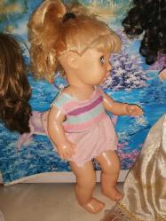 40 cm Boyunda PLASTİK BEBEK, UYUR, MAVİ GÖZLÜ, DÖNEM SAÇLI ARALARDA BOŞLUK VAR