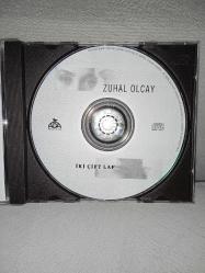 CD Zuhal Olcay İki cift laf albümü. Orijinal. Ada Müzik Dönem baskı. Dinlemeyi etkilemeyen çizikler var. sorunsuz çalışıyor. Kartonet tertemiz koleksiyonluk