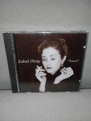 Cd Zuhal Olcay ihanet albümü. Orijinal Ada Müzik kırmızı bandrollü dönem baskı albüm. Kartonet tertemiz. Disk 10 üzerinden 9,5 çok iyi durumda sorunsuz çalışıyor koleksiyonluk