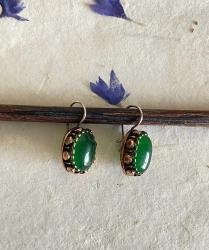 Eskitme, altın küpe görselinde küpe.