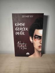 Kimse Gerçek Değil