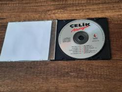 ÇELİK - ATEŞTEYİM  --ESKİ DÖNEM BASKISI MÜZİK CD Sİ-(AÇIKLAMAYI OKUYUNUZ)