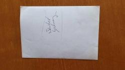 ŞEVKET YILMAZ'IN ORİJİNAL HABER METİNLİ AJANS-BASIN FOTOĞRAFI - 18 x 12 cm EBADINDA - ŞEVKET YILMAZ, SÜMERBANK İLE TEKSİP ARASINDA DÜZENLENEN TOPLU SÖZŞEŞMEDE İMZA TÖRENİNDEYKEN ÇEKİLMİŞ BİR KARE. 14 ŞUBAT 1985