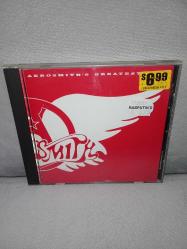 Cd Aerosmith – Aerosmith’s Greatest Hits. Orijinal Amerikan baskı. Dinlemeyi etkilemeyen çizikler var. sorunsuz çalışıyor. Kartonet tertemiz koleksiyonluk