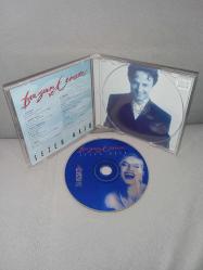 CD Sezen Aksu düğün ve cenaze. Orijinal. Raks 1997 sarı bandrollü dönem baskı albüm. Disk 10 üzerinden 9 Sorunsuz çalışıyor. kartonet tertemiz koleksiyonluk