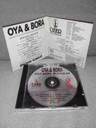 CD Oya Bora seni Bana yazmışlar albümü. Orijinal 1993 kırmızı bandrollü dönem baskı. Dinlemeyi etkilemeyen yoğun çizikler var baştan sona dinlendi sorunsuz çalışıyor