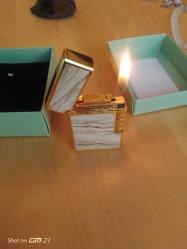 Kutusunda Dupont Çakmak. Gazlı. Çalışır. Sıfır ürün. Çok iyi metalik kapak sesi var