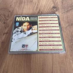 Nida - Evimizin Gelini Vurmasaydın Cd ( Dinlemeye engel olmayan kılcal çizikler vardır ) ( Dönem Cd - Sarı Bandrol )